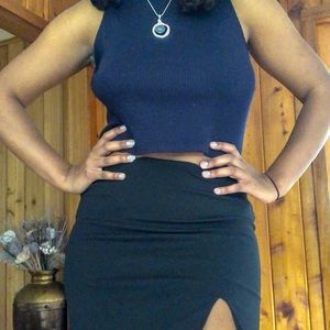 Short black mini skirt with a small slit